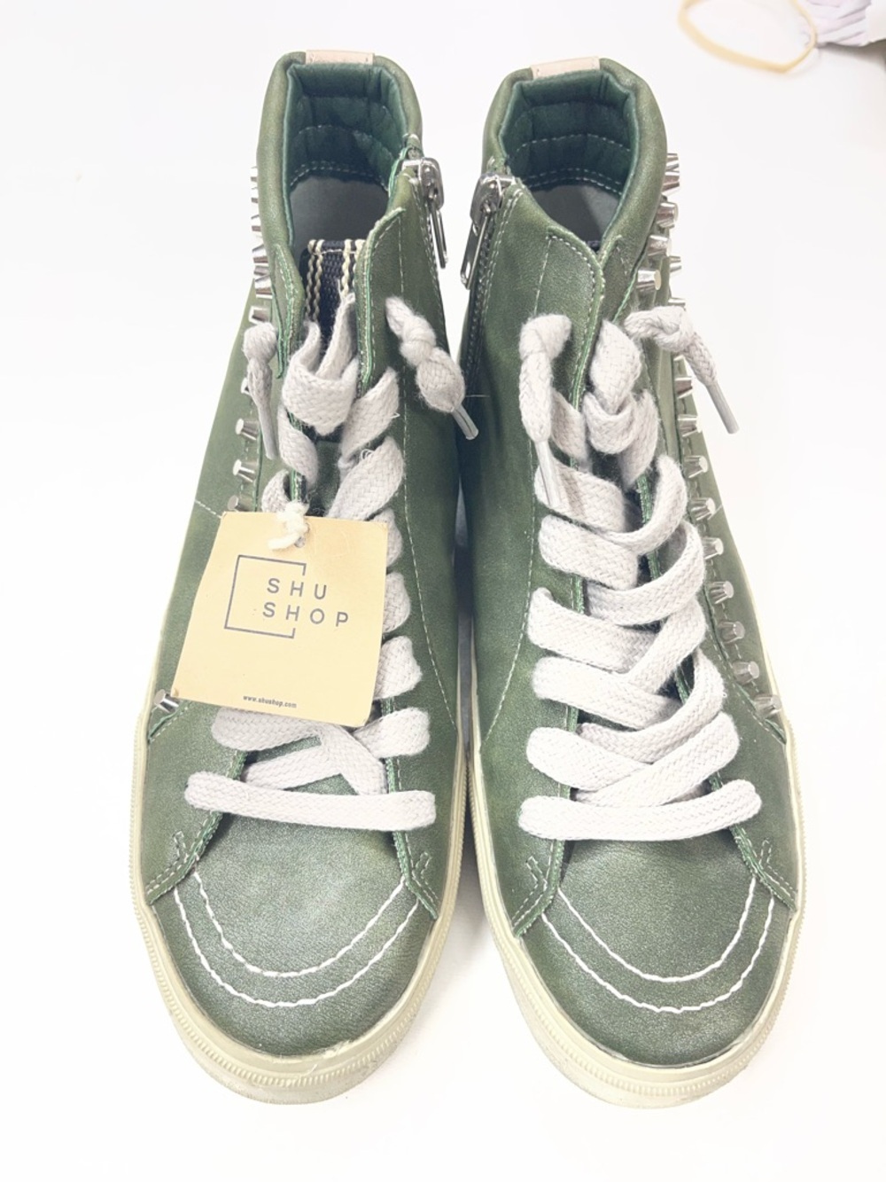 Shu Shop Roxie high-top sneakers in a metallic olive green finish and studding